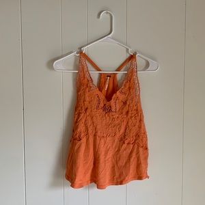 Free people size medium orange tank top with flower lace detail